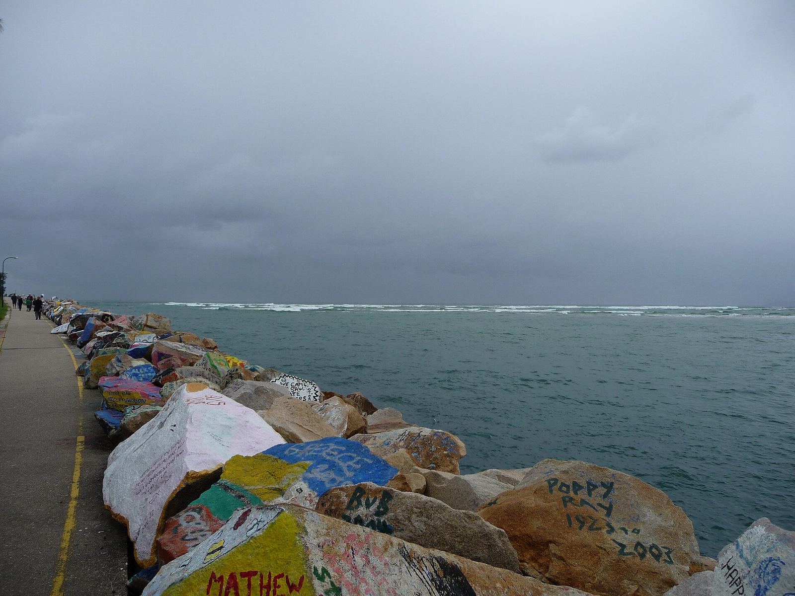 Painted rocks on the breakwall at Nambucca Heads